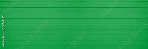 Fotografia green mint painted wooden plank wide background with wood grain texture Wide vie