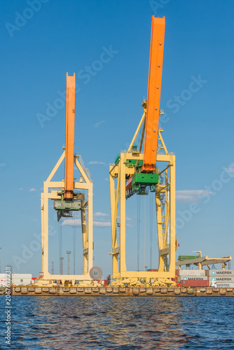 Riga Port Industrial Area with Cargo Cranes, Ships and Daugava River, Latvia