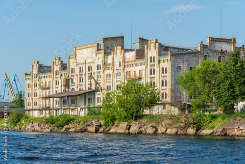 Riga Port Industrial Area with Cargo Cranes, Ships and Daugava River, Latvia