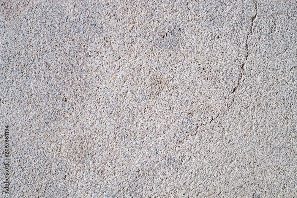 Fototapeta premium Close-up of cracked and rough concrete for overlay background.