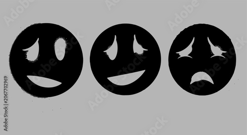 Bild auf Leinwand Three black circular emoji icons showing different facial expressions including happy and sad emotions