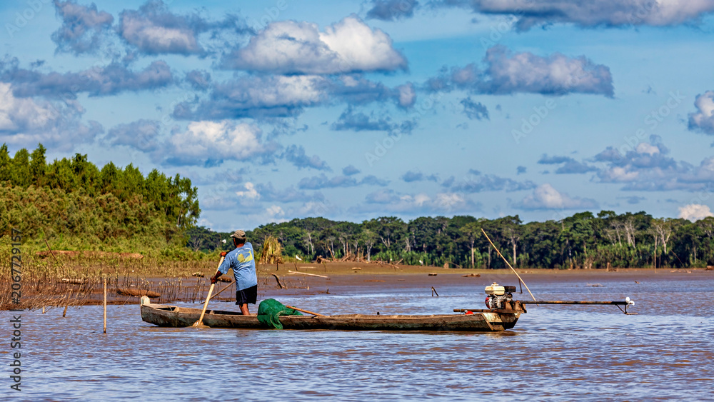 Fototapeta premium People fishing on the Beni River in the Amazon Basin near Rurrenabaque, Bolivia