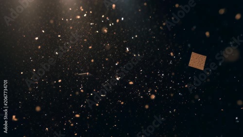 Black festive background with flying golden particles.
