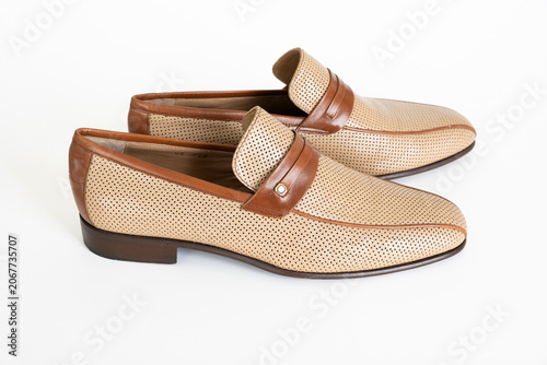 Canvas Print Stylish beige loafers with brown leather accents, featuring perforated design fo