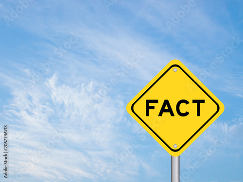 Yellow transportation sign with word fact on blue color sky background