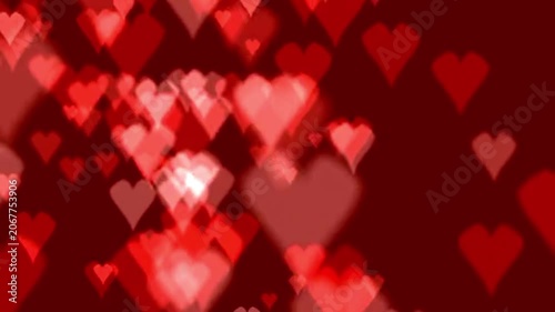 Animated background of glowing red hearts floating and gently moving in a dark romantic atmosphere perfect for valentine's day love stories or celebrations with soft focus