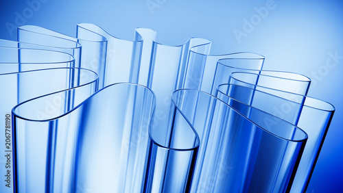 Curved translucent glass forms with clean blue background.