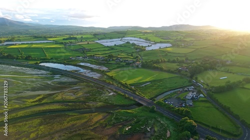 Aerial view of Dundrum bay during low tide, fields and rolling hills, Northern Ireland