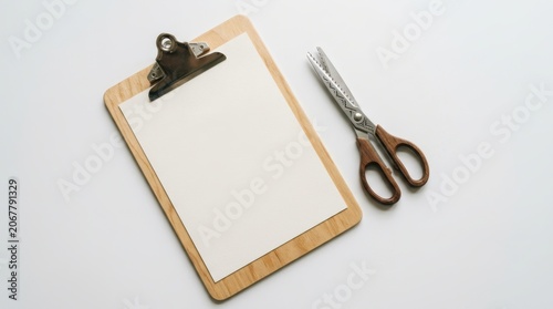 Clipboard with Blank Paper and Scissors on White Background.