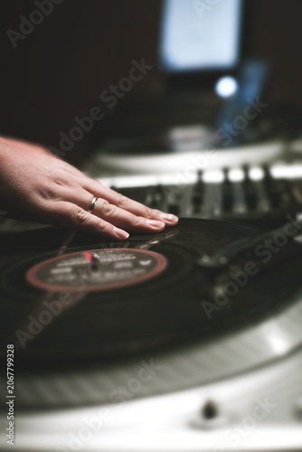 Night party with scratch dj playing vinyl