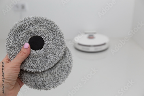 Vacuum cleaner on white glass ceramic tile floor