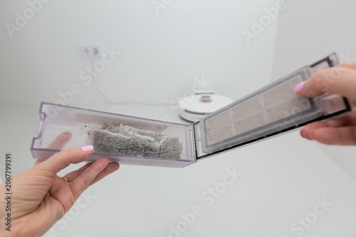 Vacuum cleaner on white glass ceramic tile floor