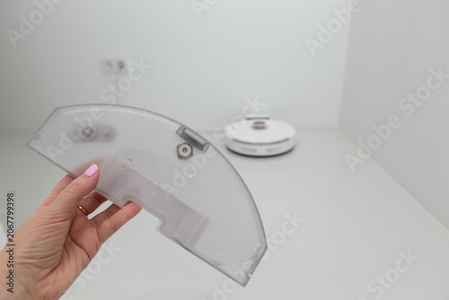 Water container closeup in female hand for wet cleaning