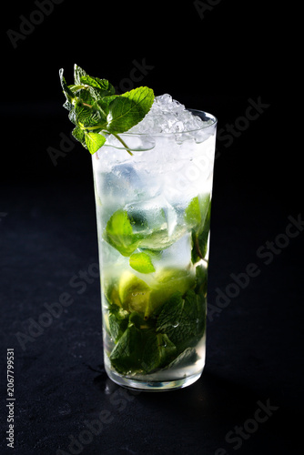 Refreshing mojito cocktail with mint and lime served in tall glass