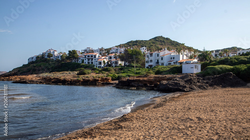 Coastal Town with White Buildings and Sandy Beach,Menorca,Spain