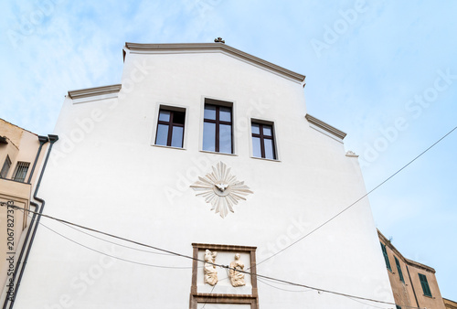The facade of the Church of San Michele in the historic center of Alghero, Sardinia, Italy. Dedicated to Saint Michael the Archangel, the patron saint of the city