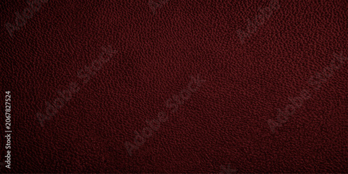 Schilderij op canvas Deep red textured leather surface, showcasing a rich, opulent, and sophisticated material with a subtle sheen and fine grain, evoking luxury and durability