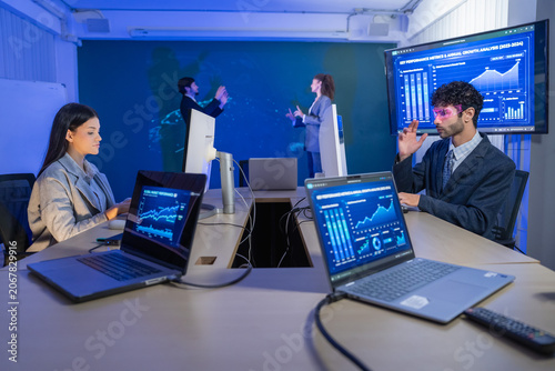 Contemporary corporate gathering in a cutting edge workspace featuring data analysis and teamwork