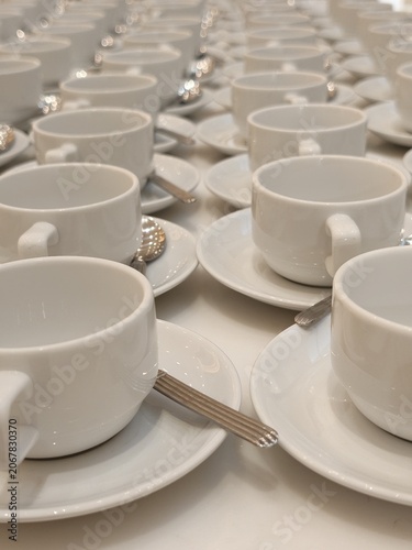 Endless Rows of White Teacups Set for Large Event