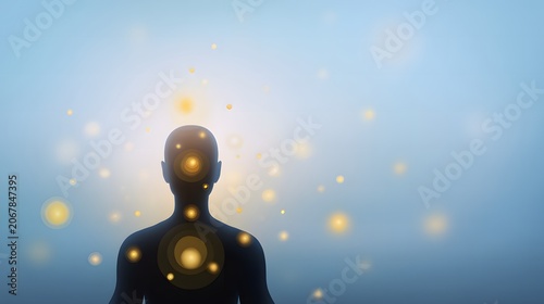Human silhouette with spheres of luminous energy