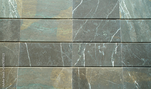 New smooth stone cladding slabs on wall closeup