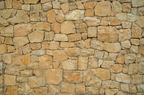 Yellow stone wall close up