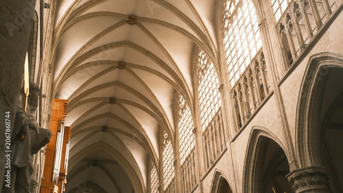 Photos Gothic cathedral interior with vaulted ceilings and arched windows