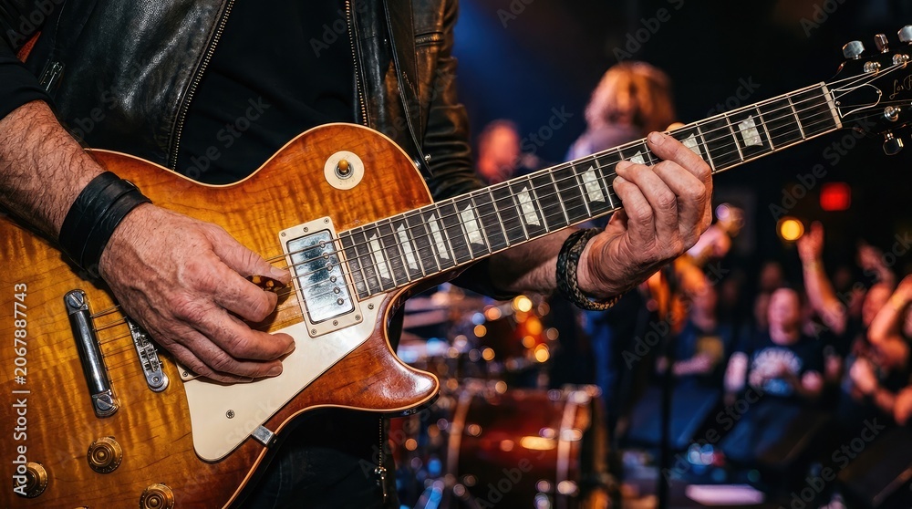 Obraz premium Musician playing electric guitar on stage
