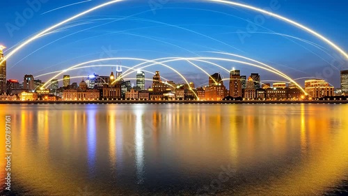 Modern waterfront cityscape with glowing arc light trails over calm water