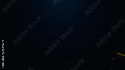 Abstract dark background with glowing colorful particle streaks and light trails