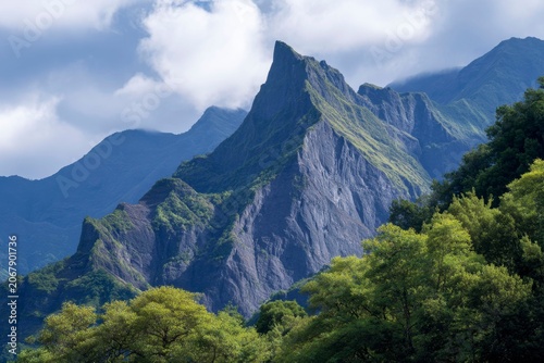 photograph of the rugged beauty of the mountains, with lush green forests and towering mountain peaks.