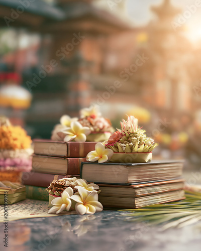 Balinese Saraswati Day Books and Floral Offerings with Temple Background