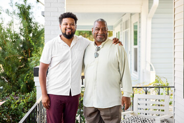 Family Members Smile Together on a Porch
