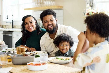 Family Shares Meal in Kitchen
