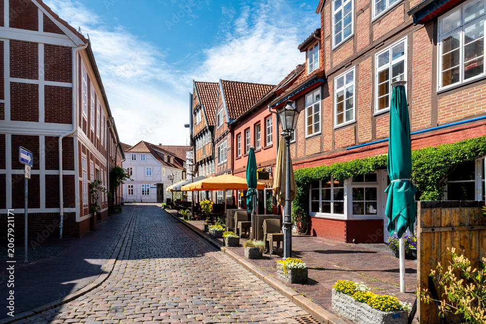 Fototapeta premium Stade, Germany, picturesque old town street with traditional buildings, cafes and summer atmosphere