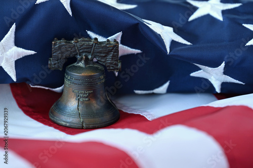 A liberty bell replica on an American Flag for the 250th anniversary semiquincentennial aka sestercentennial 