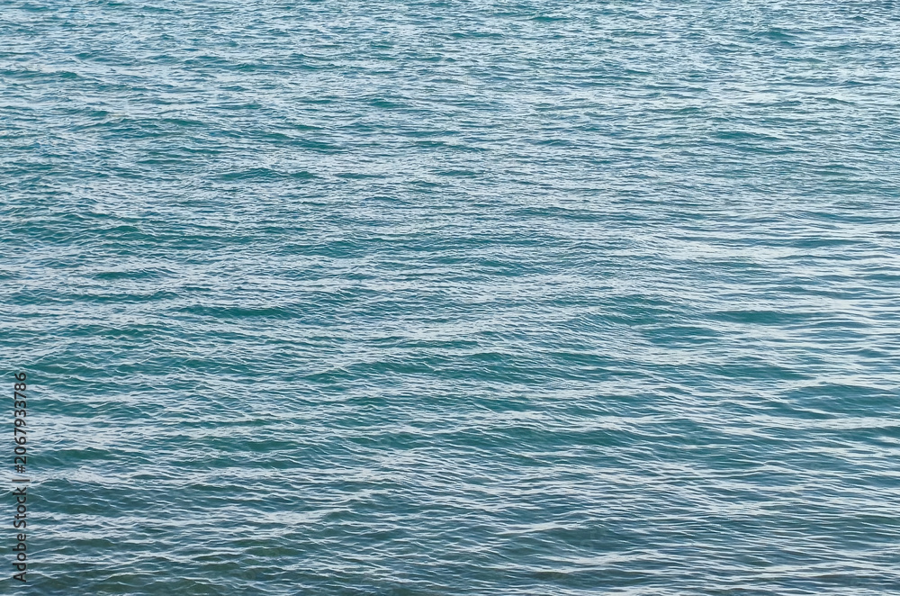 Obraz premium Sea wave. Blue waves under the summer sun. Close-up of the sea surface, natural background
