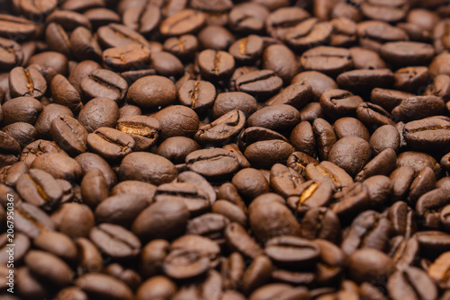 Extreme close-up texture background of roasted coffee beans.