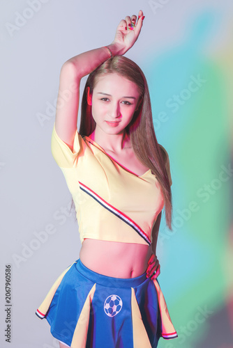 Foto Young Woman in Soccer Cheerleader Outfit Posing