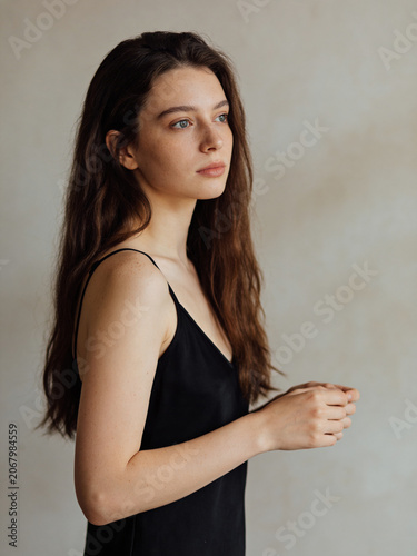 Summer sunny portrait of a young person in natural light, warm outdoor atmosphere with a bright seasonal mood and relaxed lifestyle feeling