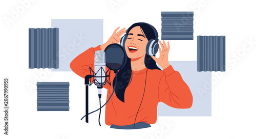 Talented young woman singing into a professional condenser microphone while wearing headphones in a recording studio with acoustic foam panels.