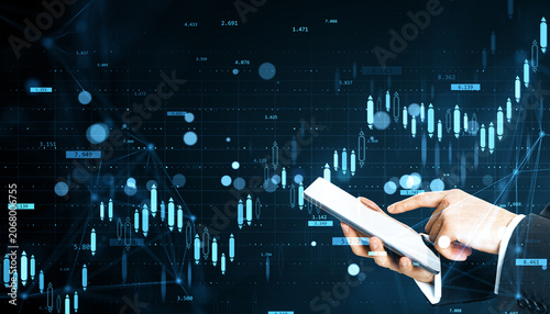 Business hands using digital tablet against glowing financial chart with data...