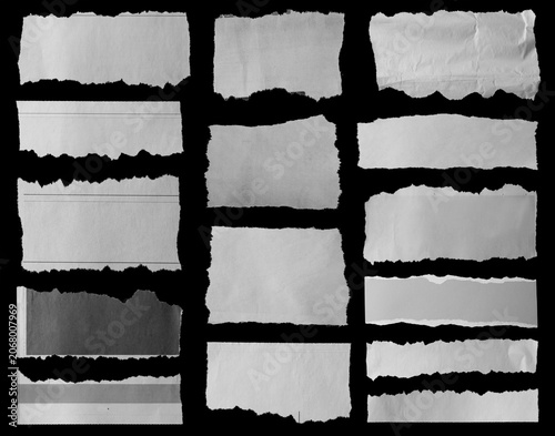 Torn papers on black