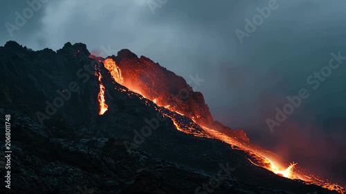 Hot lava flowing down a volcanic mountain, A volcano erupts, covered in flowing lava and billowing smoke against a darkened sky