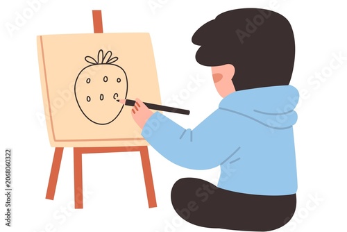 Child Drawing Pumpkin on Easel in Bright Indoor Setting with Creative Focus