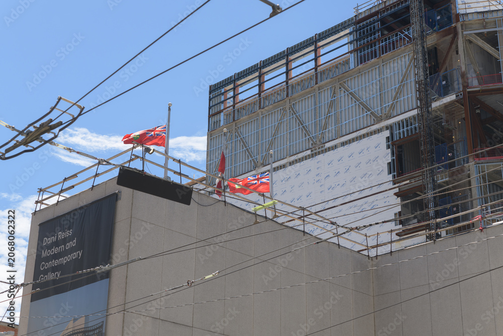 Naklejka premium mural outside construction site at the Art Gallery of Ontario expansion wing known as Dani Reiss Modern and Contemporary Gallery, McCaul St side, Toronto