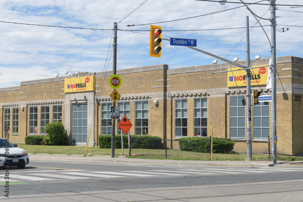 Naklejka premium wide view of Mike's NOFRILLS, a grocery store, located here at 222 Lansdowne Av, south of Dundas St W, in a former cash register manufacturing plant, Toronto