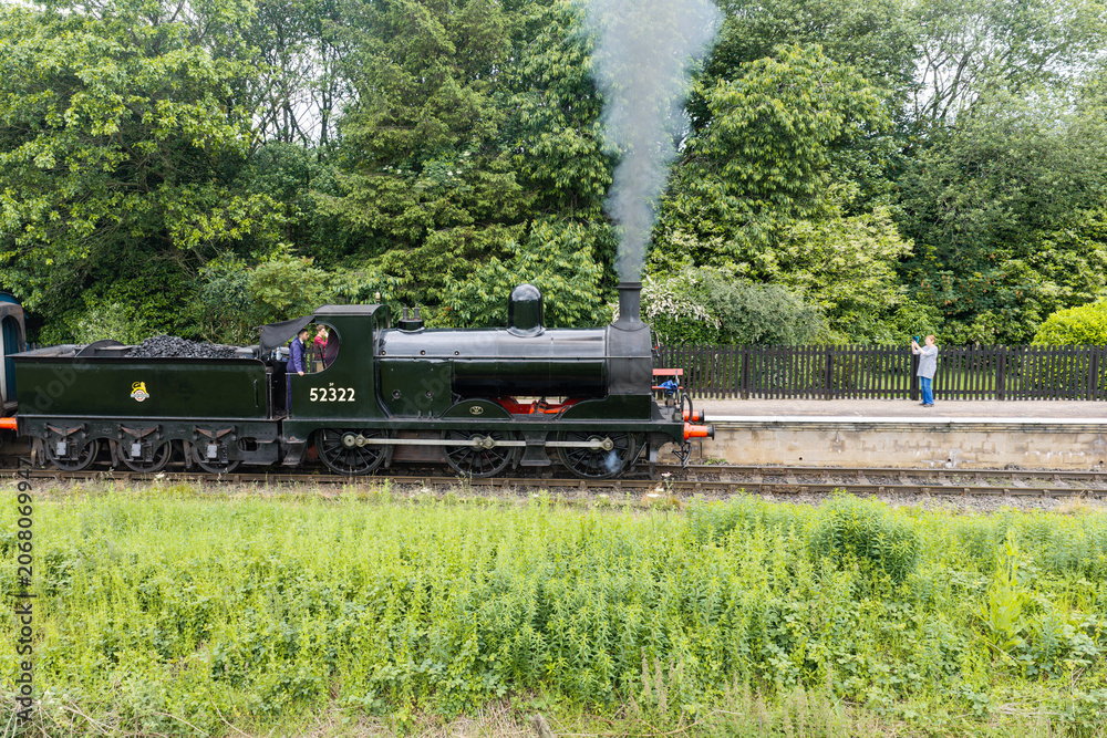 Obraz premium commuting on a steam train in Lancashire, England 