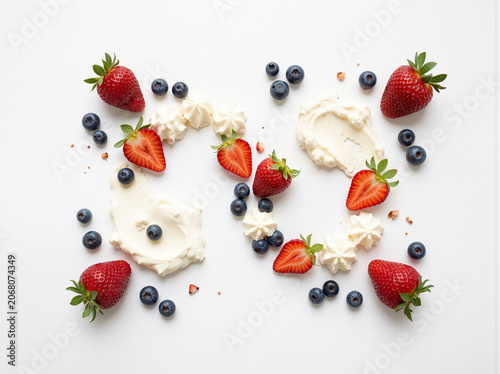 Fresh strawberries, blueberries, and whipped cream, healthy dessert ingredients, sweet treats, fruit toppings