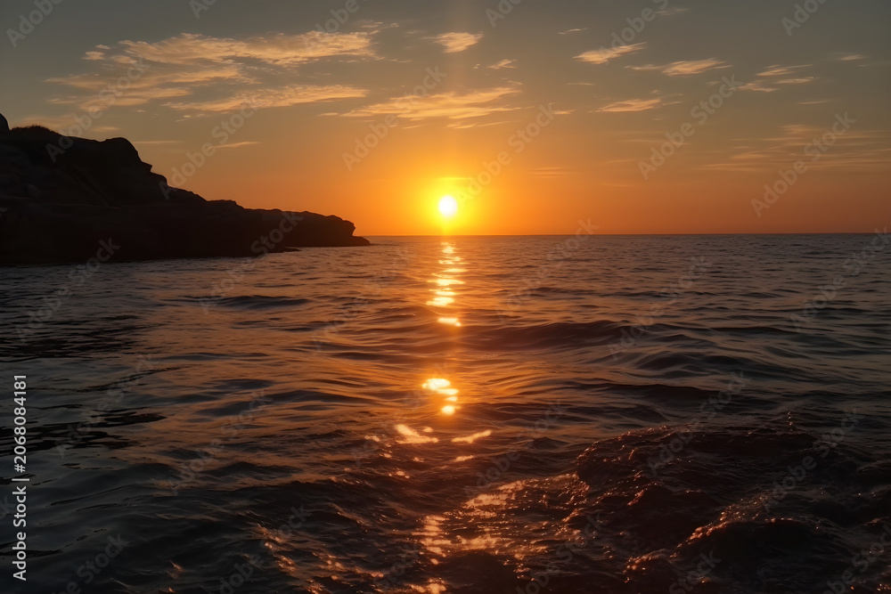 Obraz premium Warm Mediterranean Sunset Scene With Still Sea Mediterranean Travel Background Peaceful Coastal Wallpaper